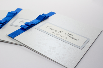 Dark royal blue, silver and white butterfly classic evening wedding invitations with flat bow