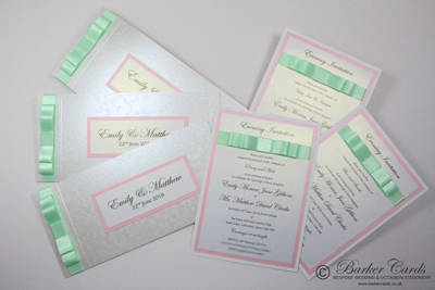 Baby pink and mint green handmade wedding invitations with butterfly theme