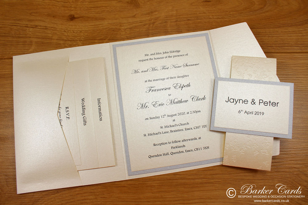 contemporary_pocketfold_wedding_invitations_in_ivory_cream_and_silver_with_band_and_ribbon_02